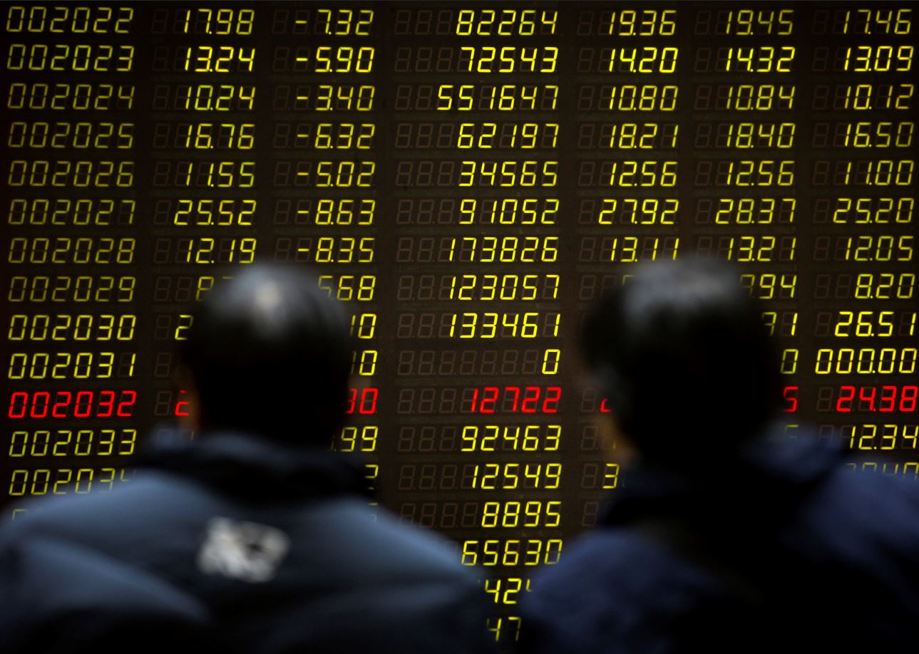 Ceden Bolsas de China y Tokio, entre ganancias corporativas