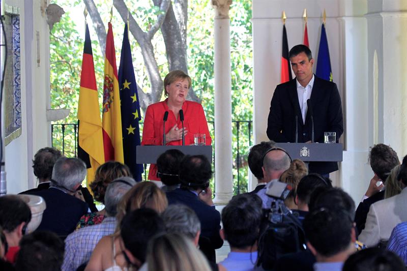 España y Alemania piden esfuerzo común en UE con inmigrantes