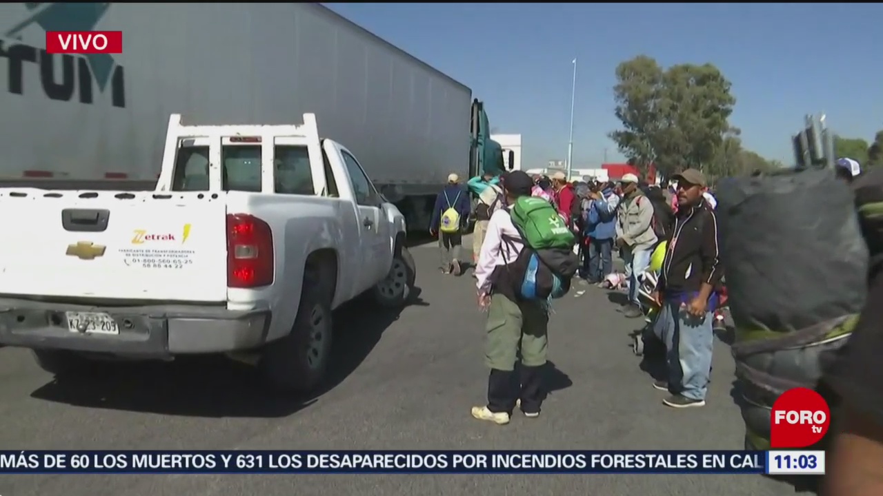 Migrantes bloquean la autopista México-Querétaro