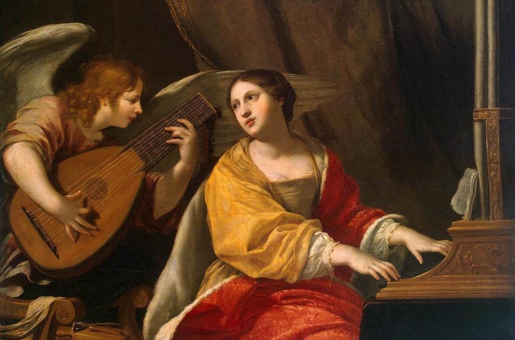 Santa Cecilia en una de sus representaciones más comunes, tocando un órgano y cantando (Zupnija)