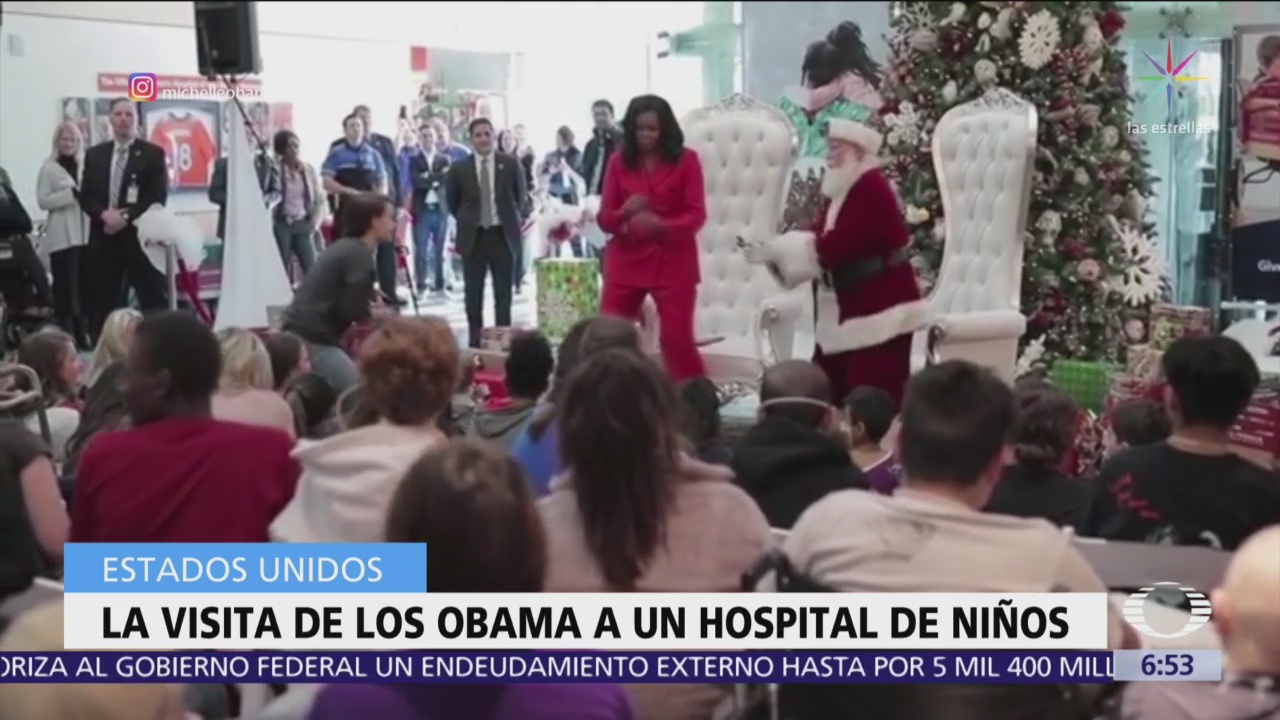 Barack y Michelle Obama visitan hospital y regalan juguetes