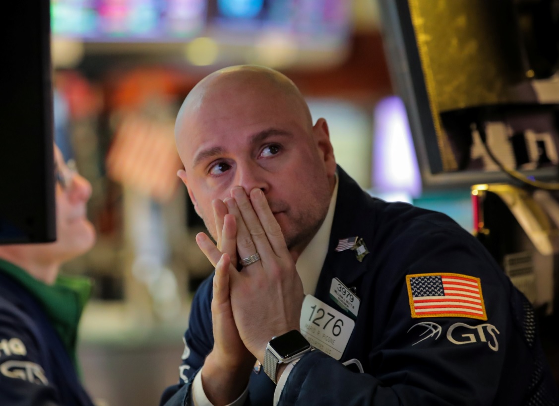 Foto: Un comerciante trabaja durante el anuncio de la tasa de la Fed en el piso de la NYSE en Nueva York, marzo 20 de 2019 (Reuters)