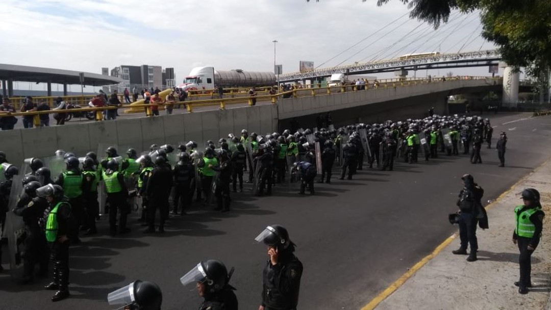 Videos y fotos: enfrentamiento de policías federales y capitalinos en AICM