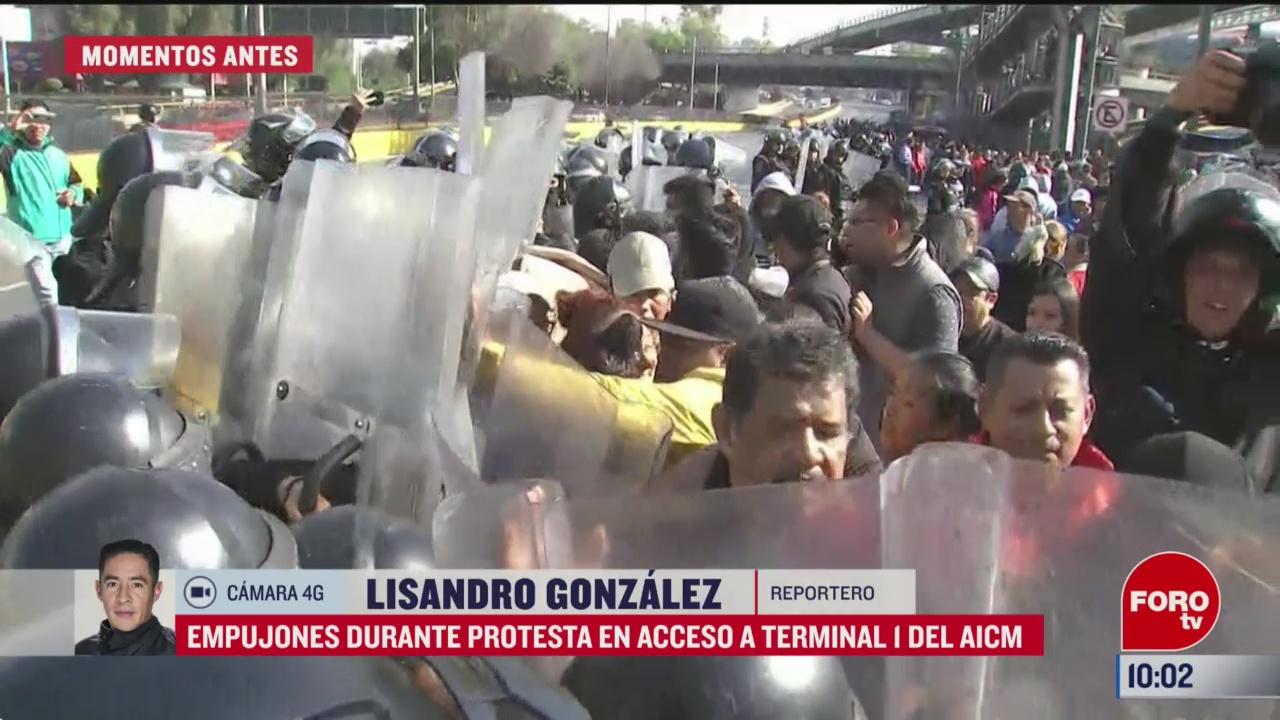 empujones durante protesta en acceso a terminal 1 del aicm