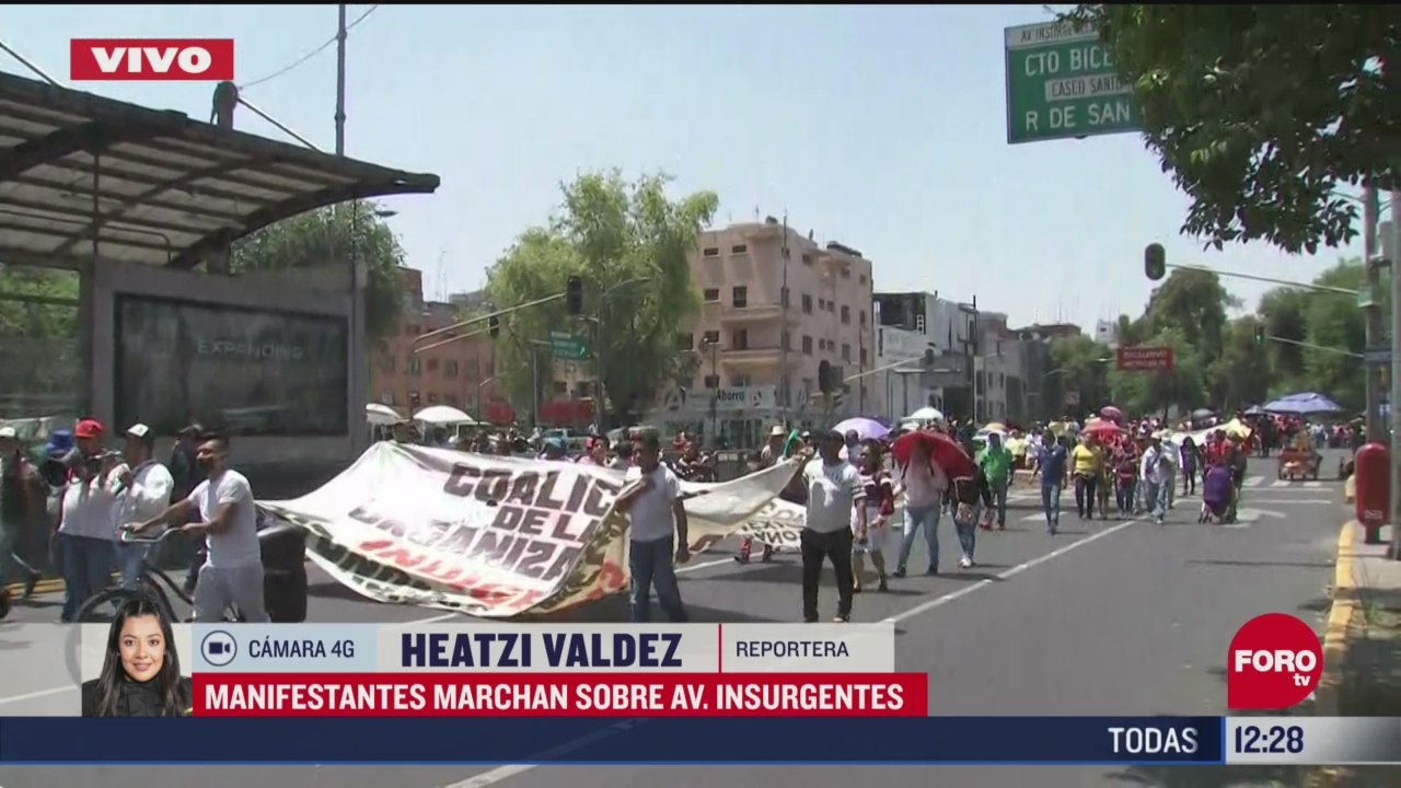 manifestantes marchan sobre avenida insurgentes cdmx