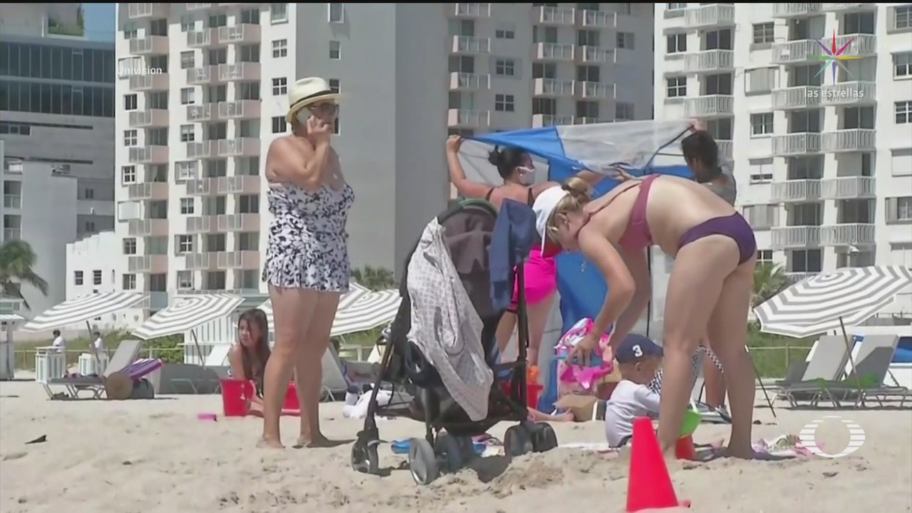 con restricciones reabren playas en miami florida