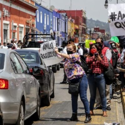 Protestan en visita de AMLO a Cholula, Puebla