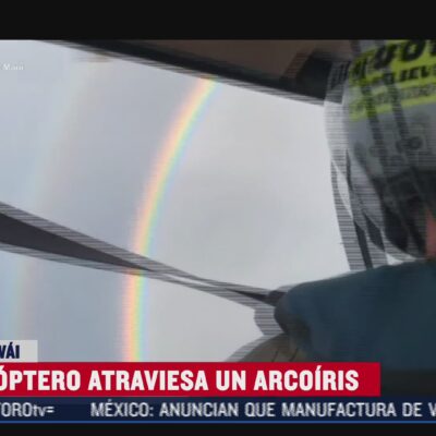 El impresionante momento en que un helicóptero atraviesa un arcoíris
