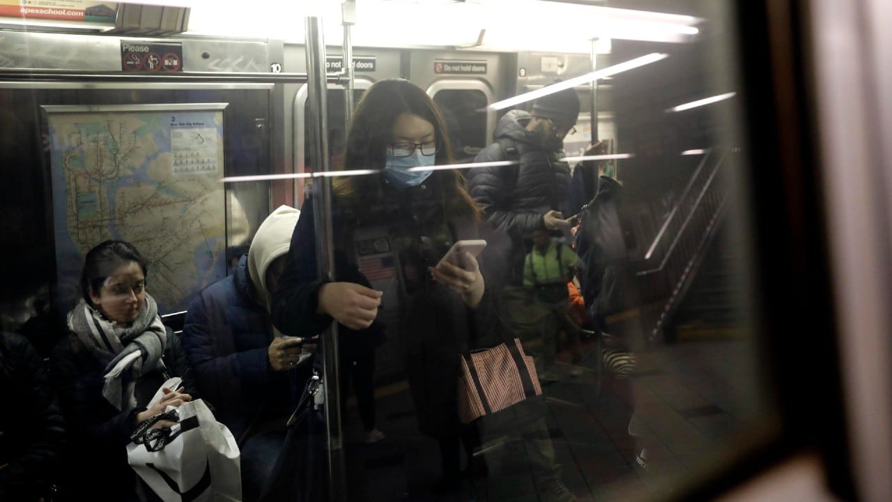 Personas en el Metro de Nueva York